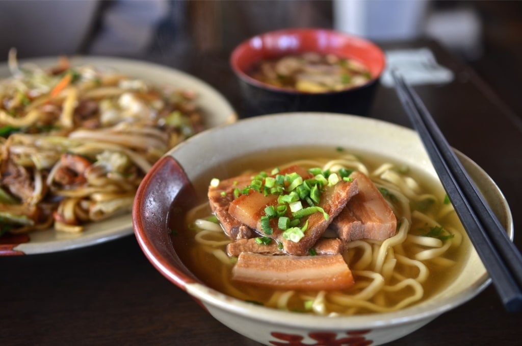 Traditional Okinawan food, with soba dish served in a rich broth with toppings