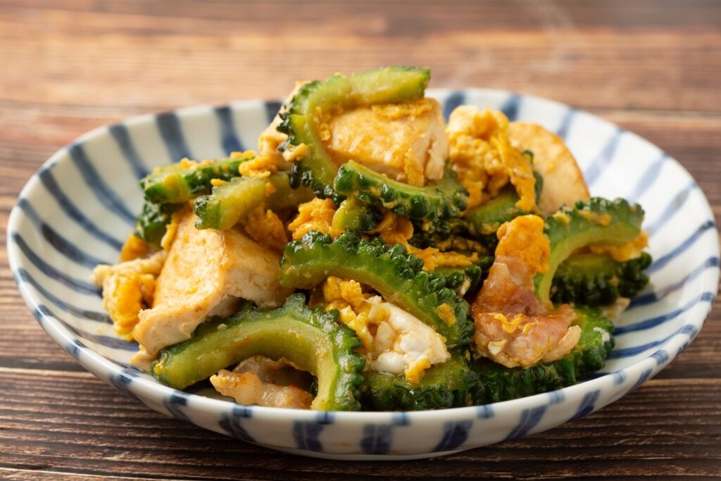Plate of Gōyā Chanpurū, stir-fry Okinawan food with bitter melon, tofu, and pork