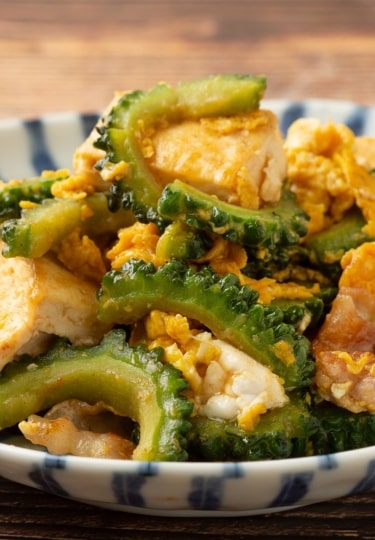 Plate of Gōyā Chanpurū, stir-fry Okinawan food with bitter melon, tofu, and pork