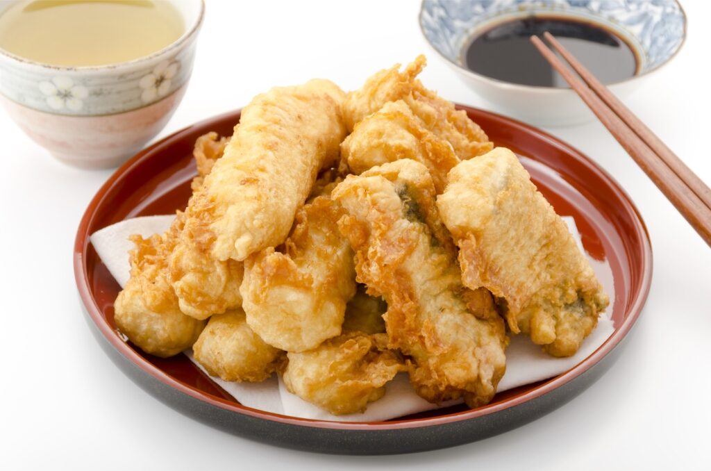 Tempura, traditional Okinawan food served with a side of soy-based dipping sauce