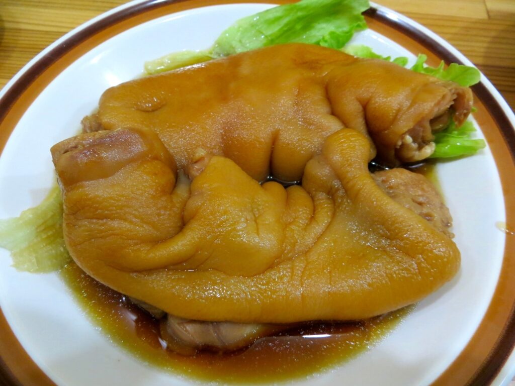 Serving of Tebichi, Okinawan pork trotters simmered in flavorful broth