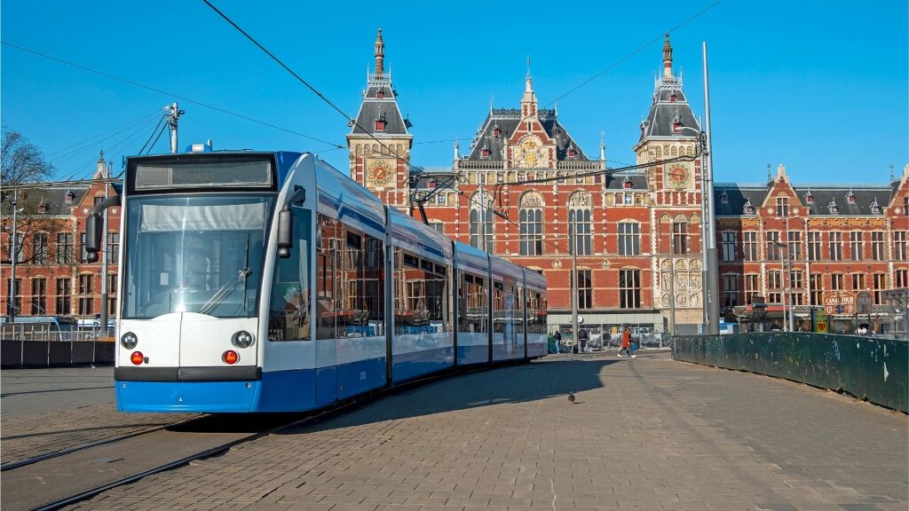Tram passing in front of Amsterdam Central Station