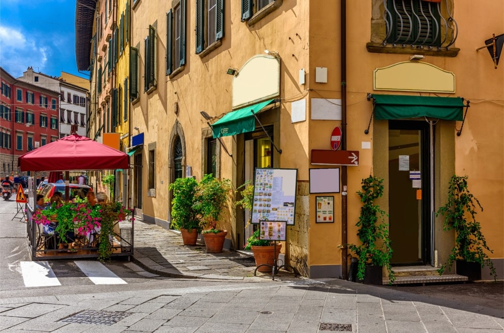 Street view of Borgo Stretto in Pisa, Italy with historic buildings and shops