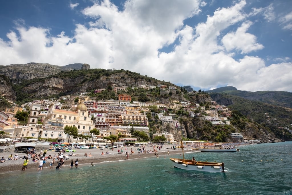 Crowds relaxing on Spiaggia Grande, the main beach in Positano, Italy