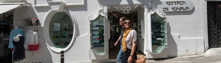 Travel couple wandering Positano’s charming streets