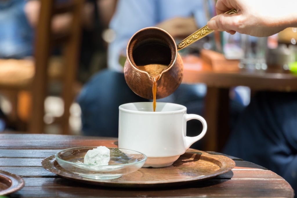Pouring coffee at a cafe in Greece