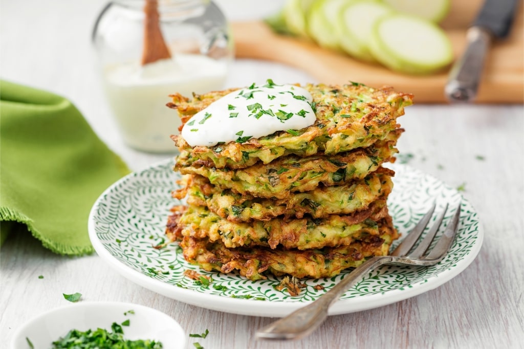 Stack of zucchini fritters on a plate