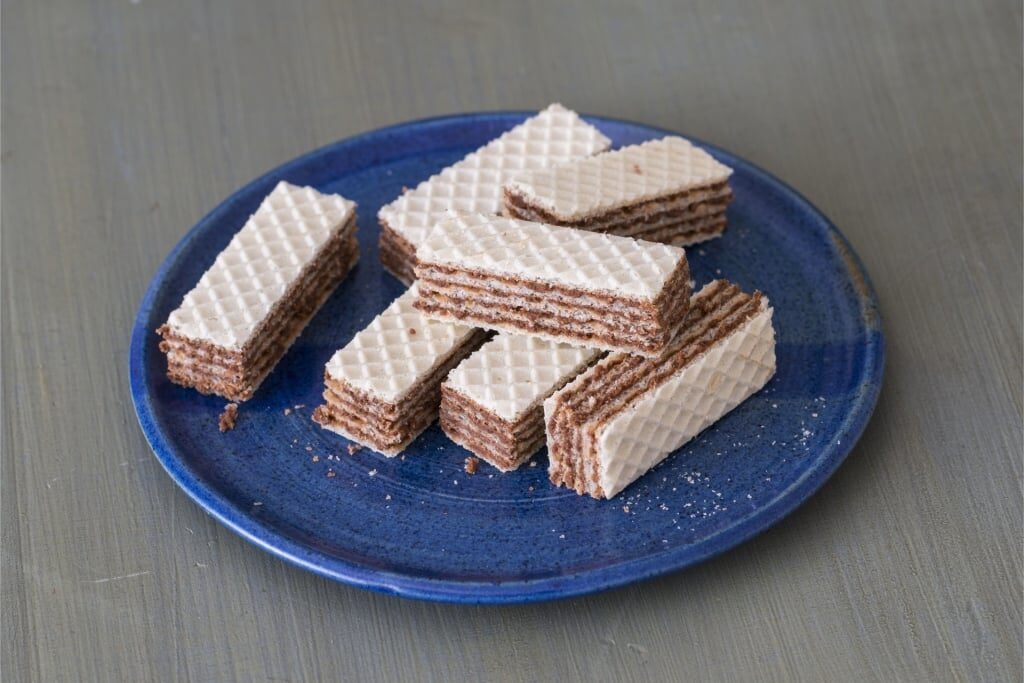 Light and crunchy wafers placed on a blue plate