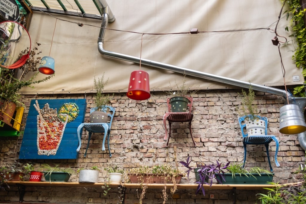 Colorful hanging chairs on wall at Szimpla Kert, Budapest