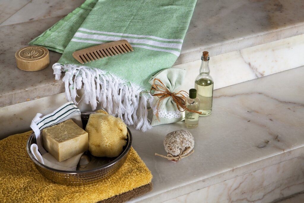Traditional Turkish bath items like bowl, soaps, and towel
