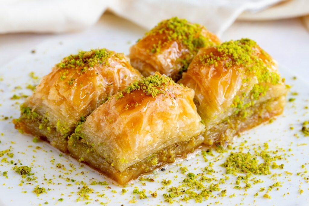 Baklava slices topped with crushed pistachios