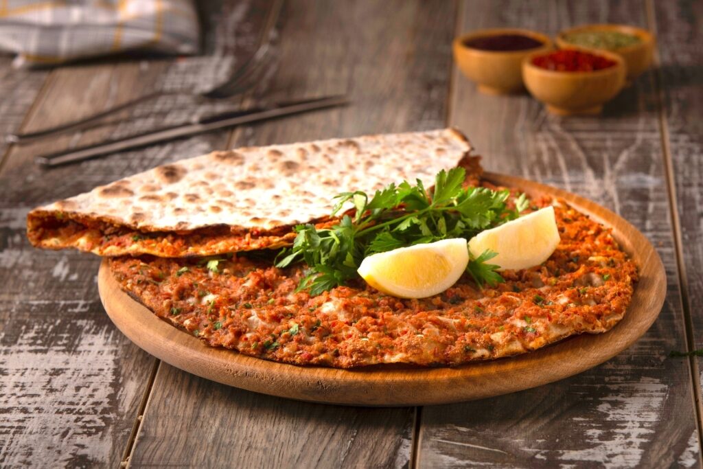 Traditional Turkish Lahmacun flatbread with minced meat topping