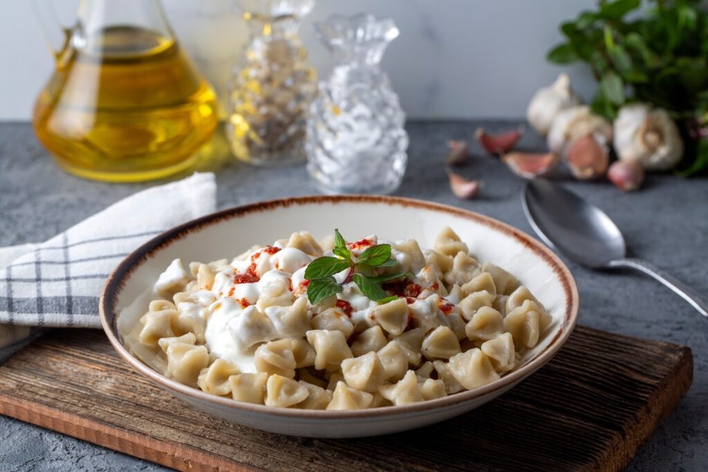 Plate of Manti with garlic yogurt