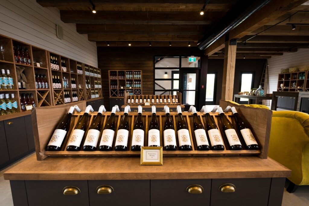 Local Nova Scotia wines displayed on a wooden shelf