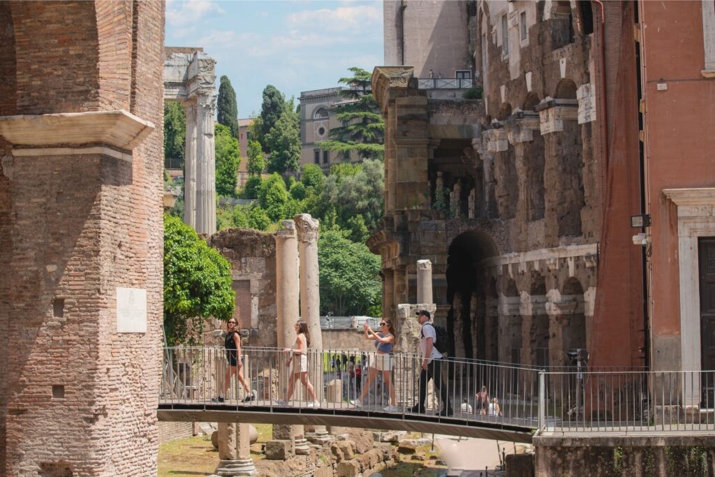 Visitors exploring the Roman Forum archaeological site in Rome