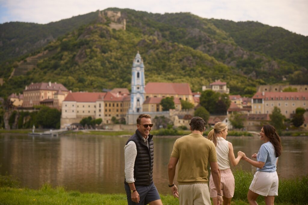 Tourists enjoying the riverside views in Dürnstein, Austria