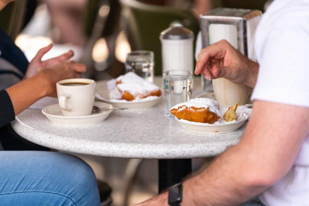 People eating beignets at Café du Monde