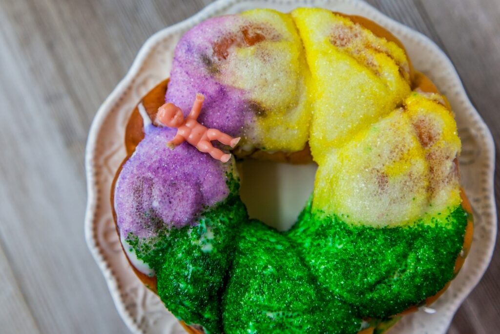 Colorful New Orleans King Cake on a plate
