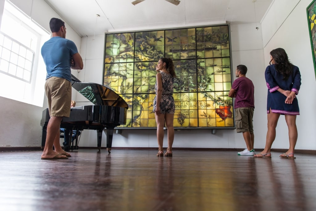 People admiring art inside Curaçao Museum