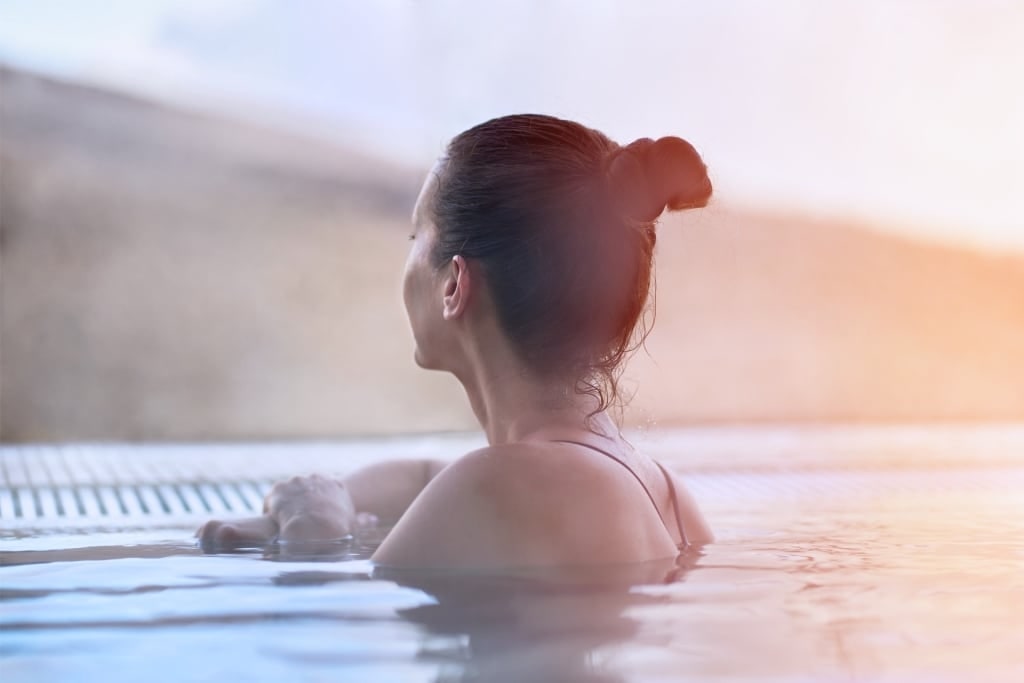 Woman enjoying view at thermal spa