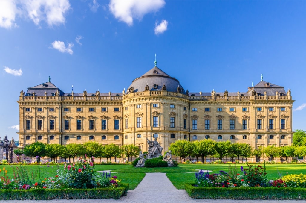 Baroque-style Würzburg Residence and garden under sunny sky