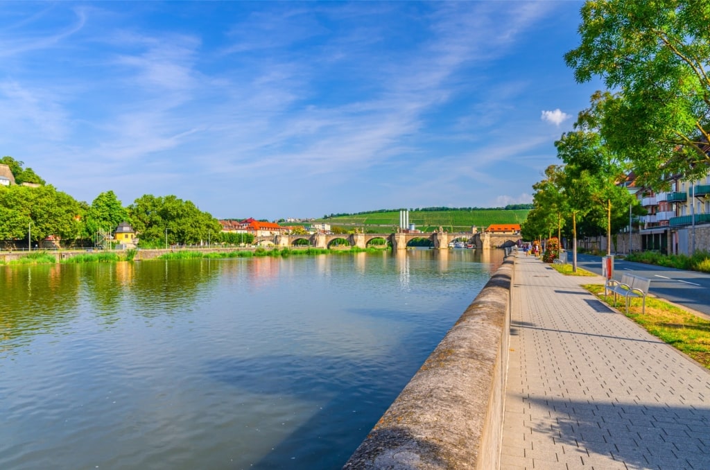 Scenic Main River embankment in Würzburg with view of bridge