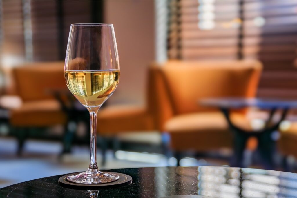 Glass of Alsatian Gewürztraminer white wine at a restaurant in Strasbourg