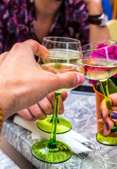 Glasses of Alsace wine raised for a toast