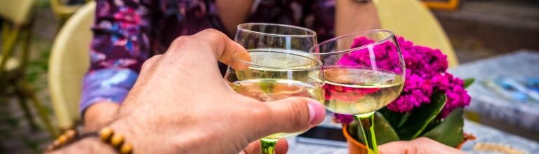 Glasses of Alsace wine raised for a toast