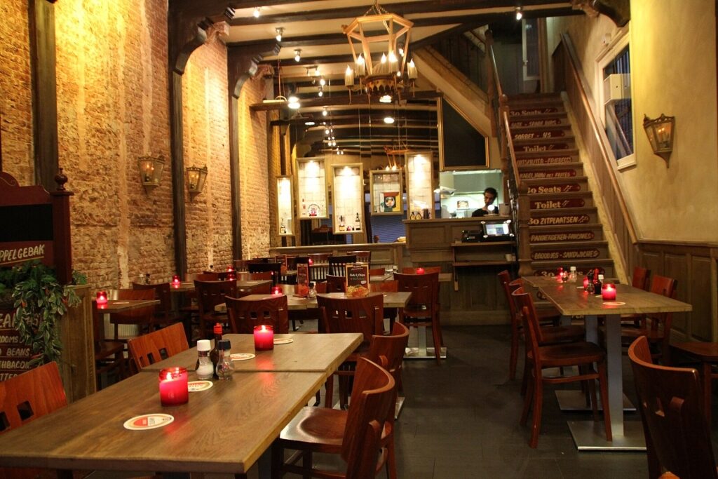 Cozy brown café in Amsterdam with wooden interiors and warm lighting