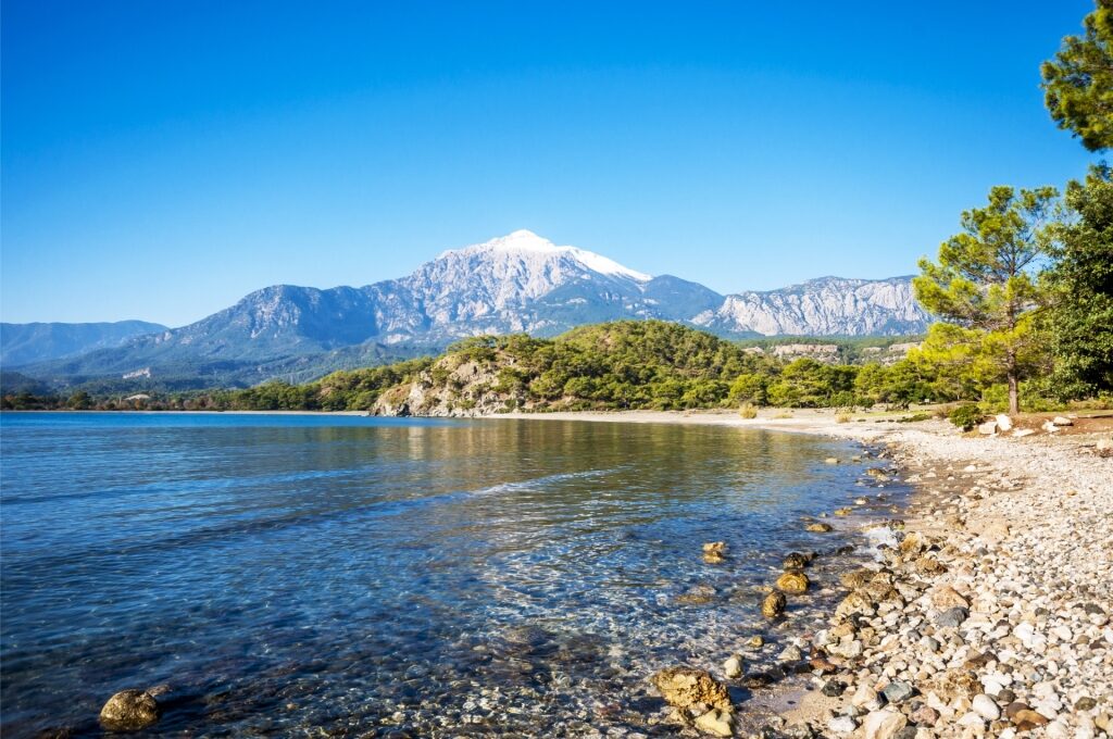 Phaselis Beach in Antalya with turquoise waters and dramatic mountain backdrop