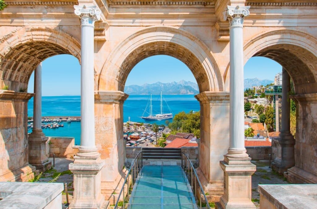 View of Hadrian’s Gate in Antalya Old Town with the harbor