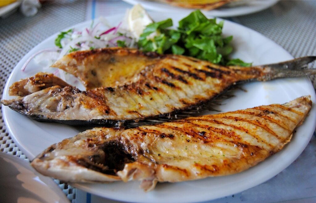 Grilled sea bream fish served on a plate in Turkey