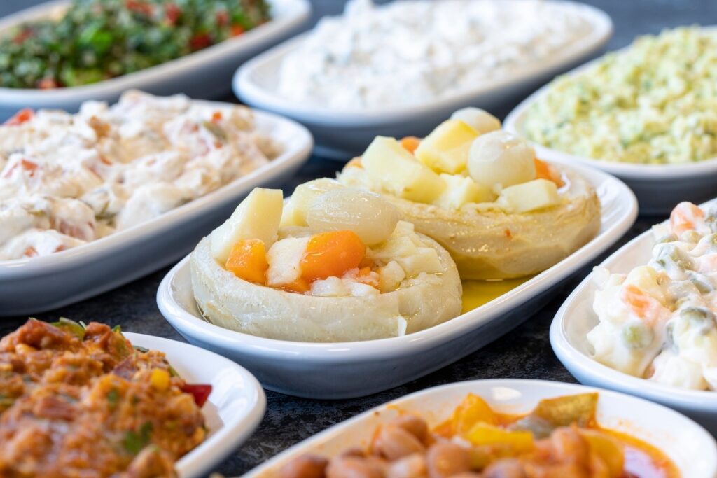 Assorted Turkish mezze plates filled with colorful appetizers