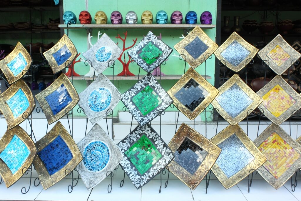 Colorful Balinese ceramic plates arranged on a market display