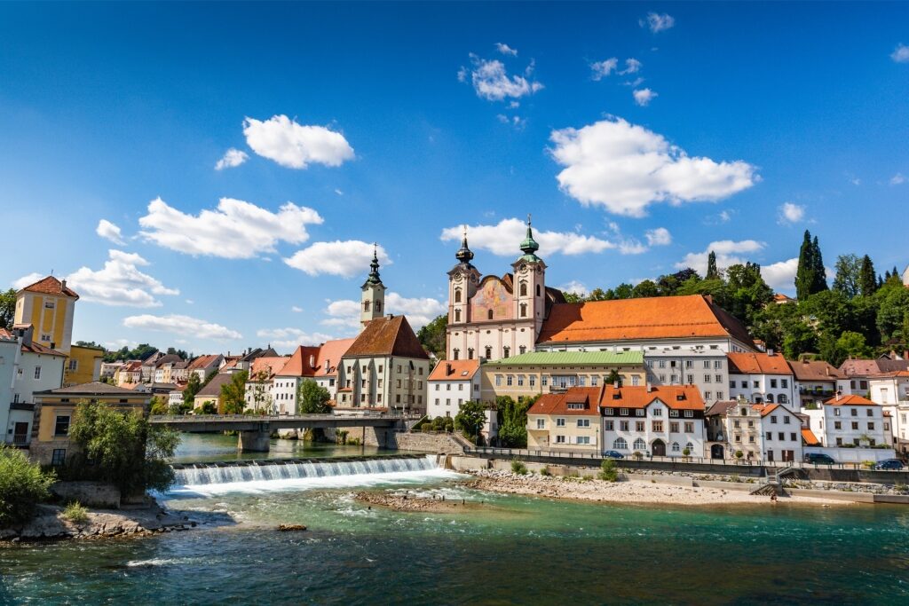 Scenic view of Steyr, Austria, with colorful historic buildings along the river