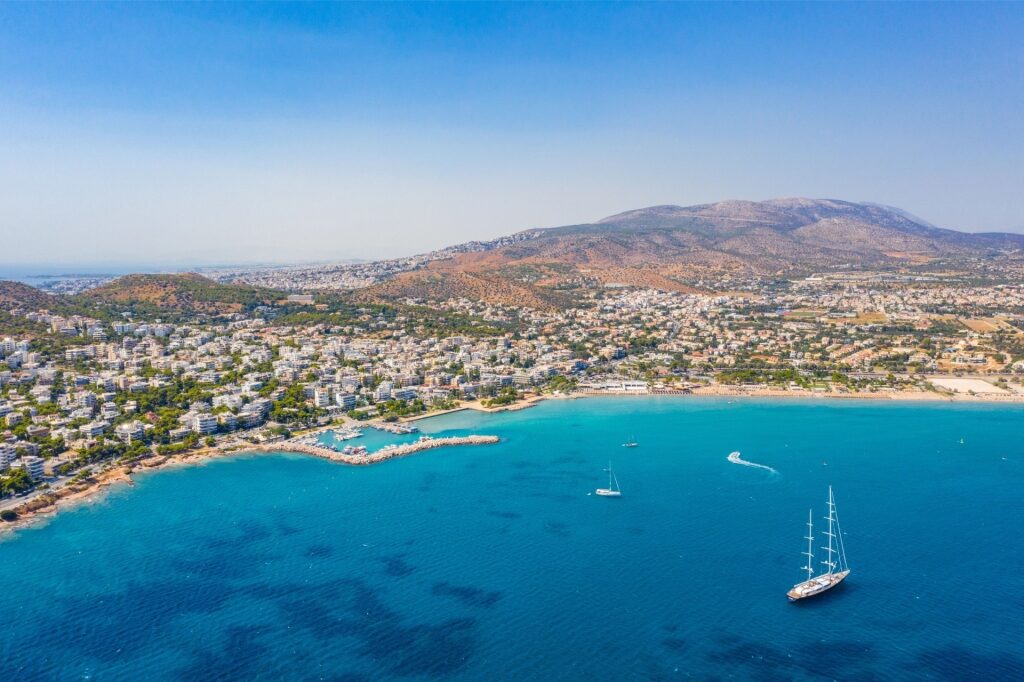 Panoramic view of sandy beach with clear waters in Athens, Greece