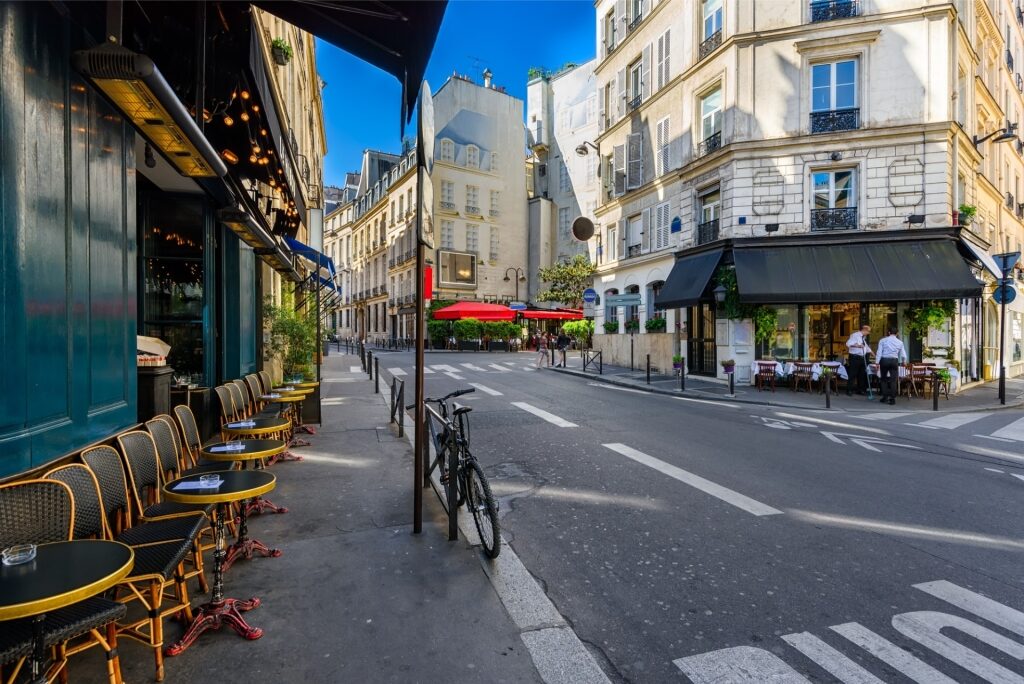 Paris, France street lined with cafes and shops