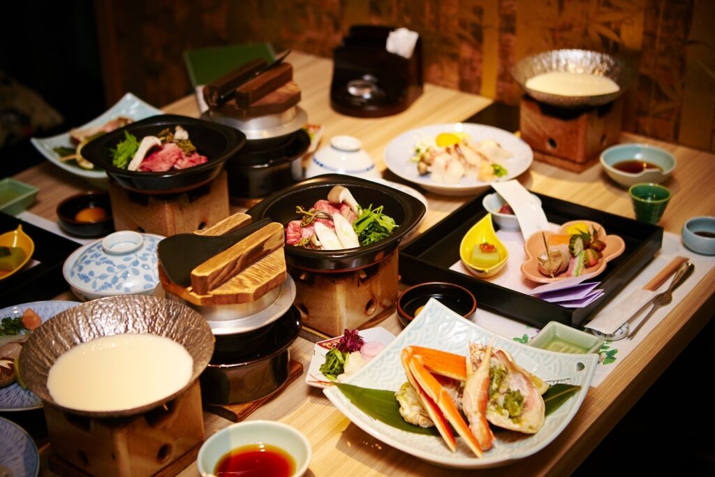 Traditional Japanese Kaiseki meal with arranged seasonal dishes