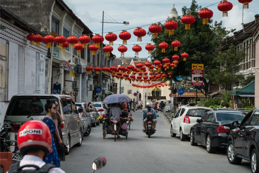 Vibrant red lanterns hanging above a historic street in George Town, Malaysia