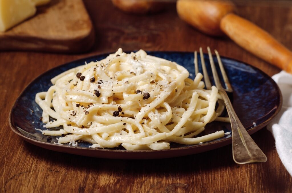 Authentic Italian cacio e pepe served on a plate with simple garnish