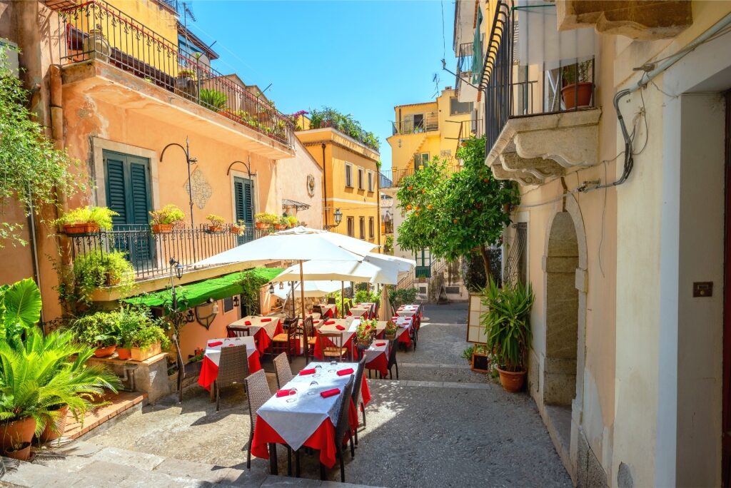 Pedestrian street with cafe in old town Taormina, Sicily, Italy