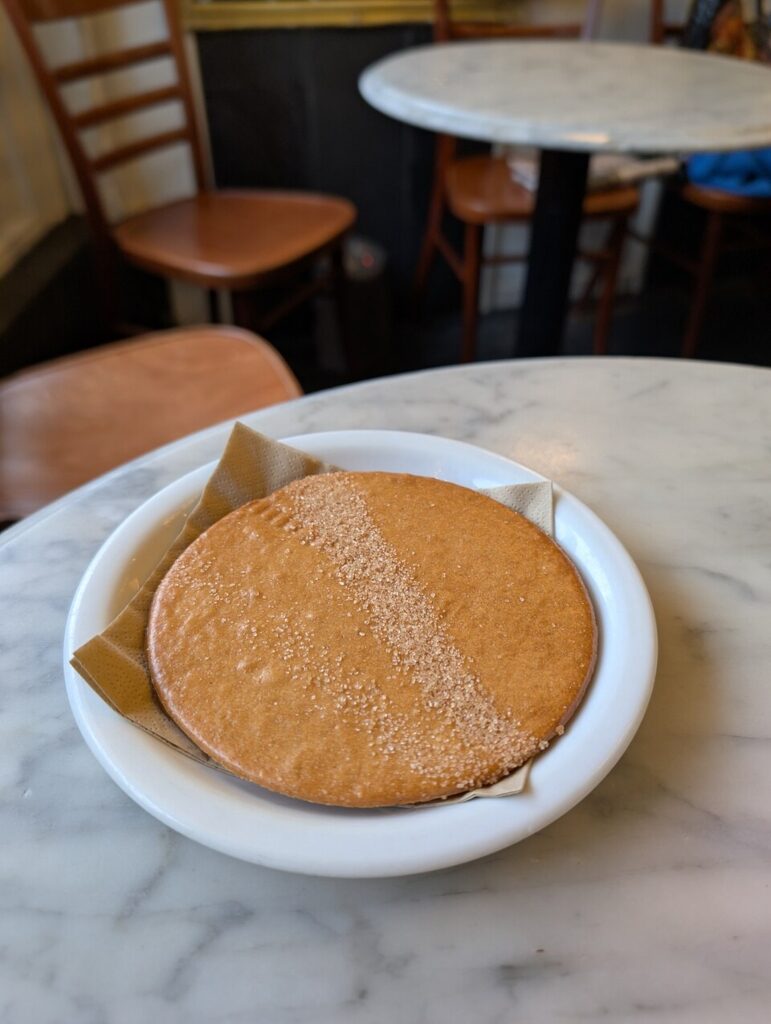 Big freshly made stroopwafel from Lanskroon bakery in Amsterdam