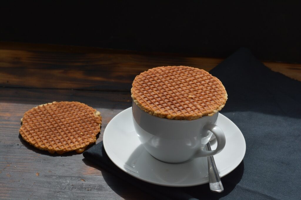 Dutch stroopwafels with hot coffee on a cozy café table