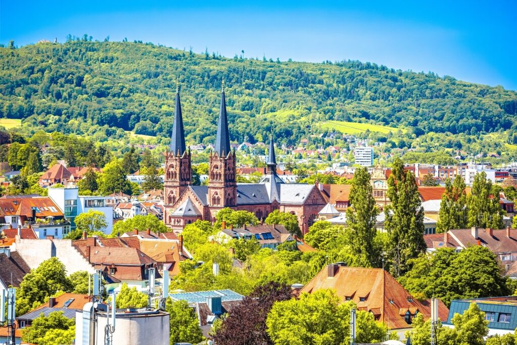 Scenic aerial shot of Freiburg city center and nearby Black Forest landscape