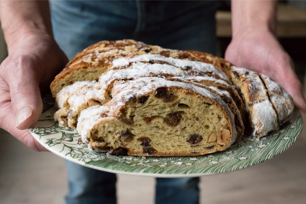 Traditional kerststol Christmas bread on a plate