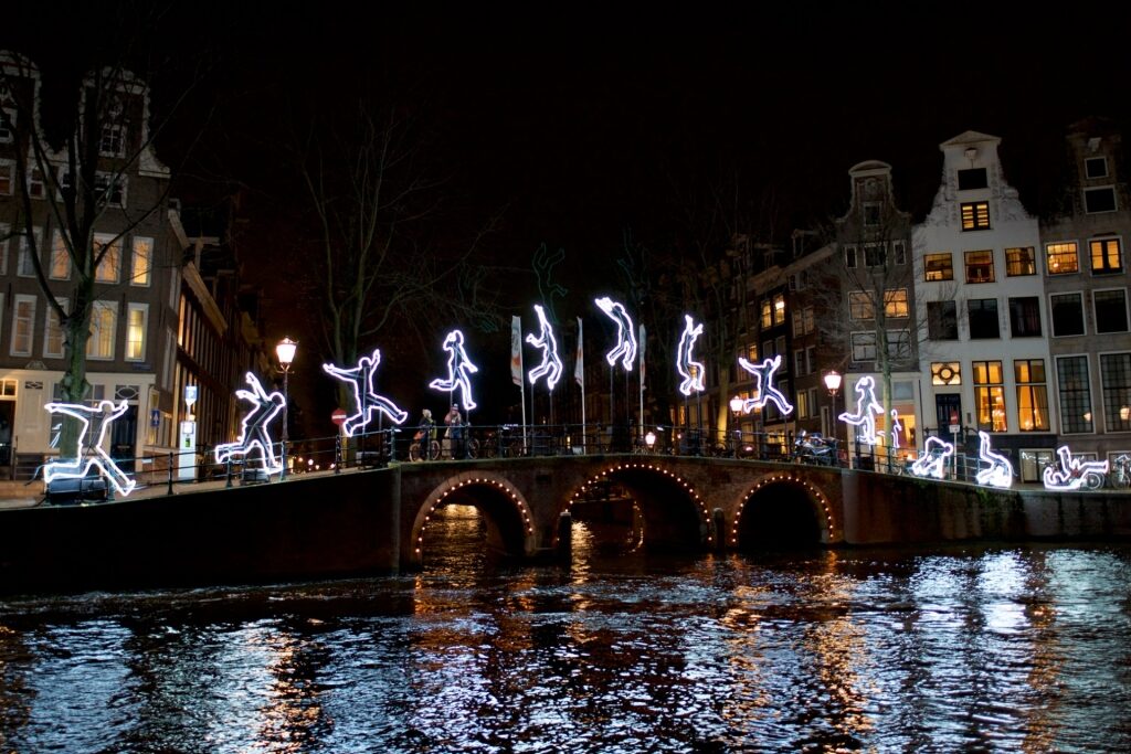 Lighted art installations illuminating the canals during the Amsterdam Light Festival
