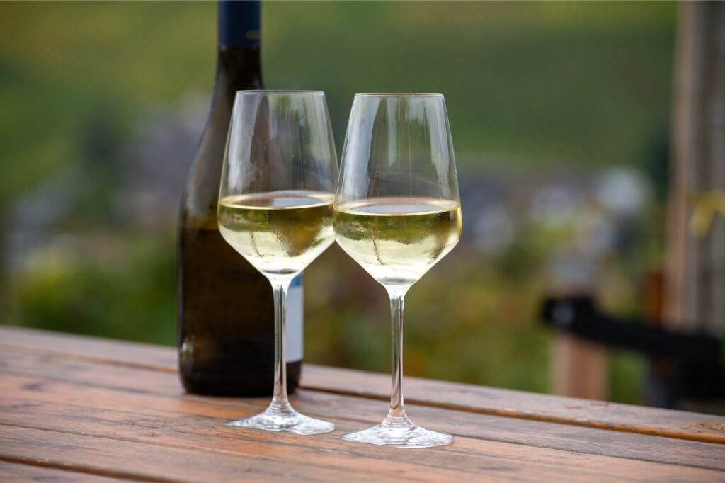 Two glasses of Riesling white wine on a table