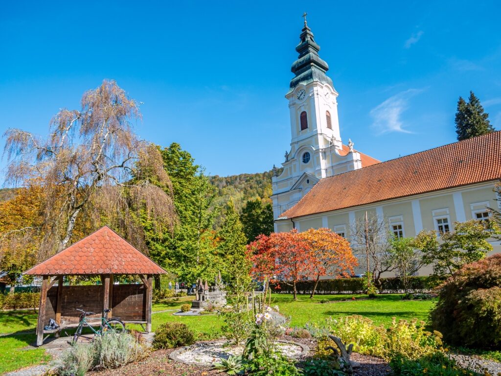 Historic Stift Engelszell building with greenery and trees