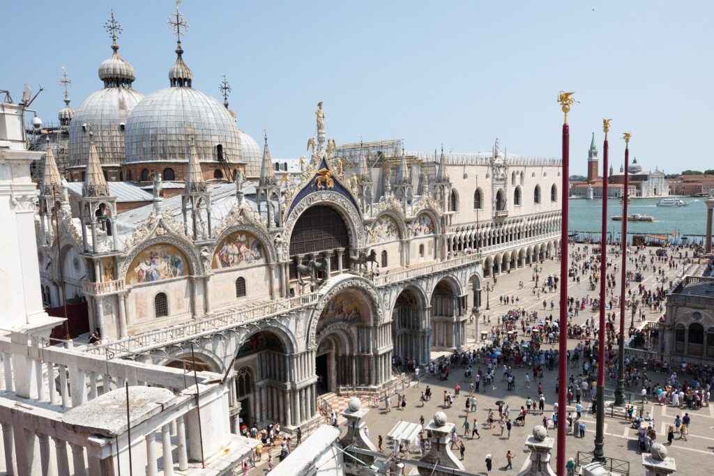 Crowds of visitors in front of the iconic St. Mark’s Basilica in Venice